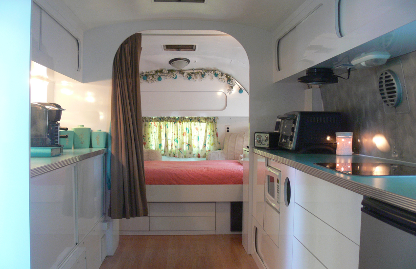 Clean white retro RV interior.