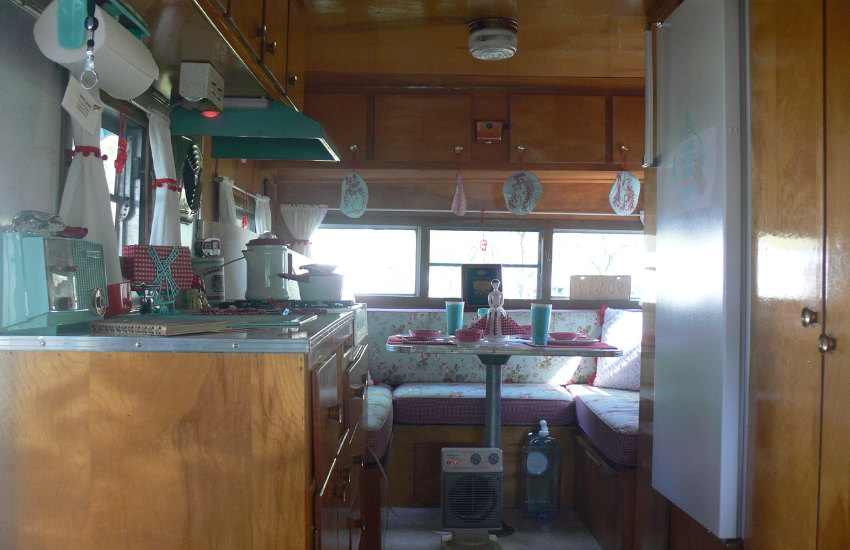 A vintage camper with cute and quirky accessories.