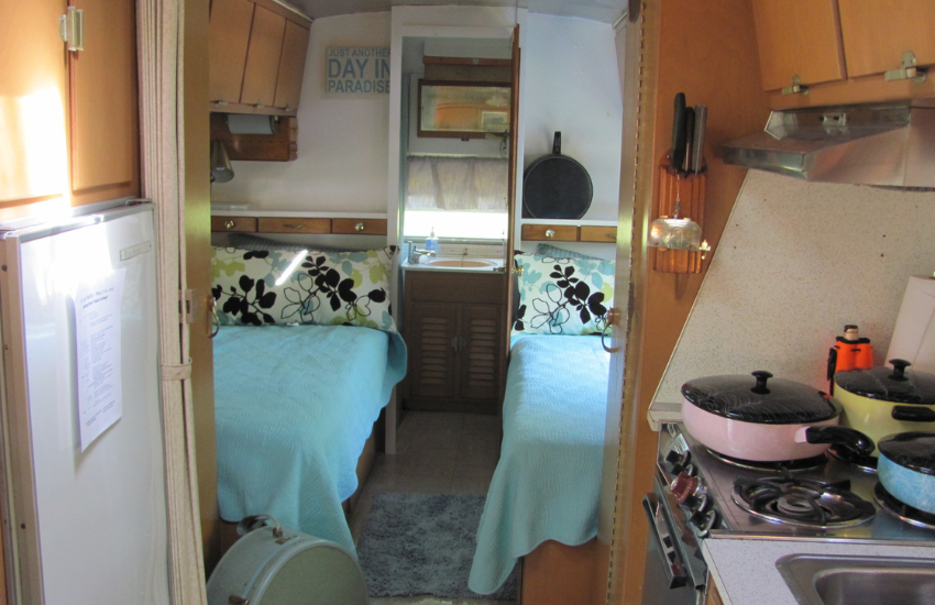 Vintage camper trailer with twin beds.