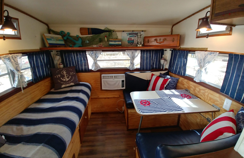 Blue and white stripey decor in a vintage camper interior.
