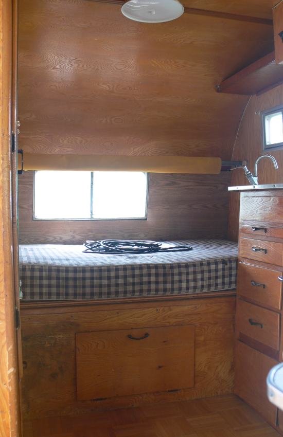 Wooden paneling in an old RV trailer.
