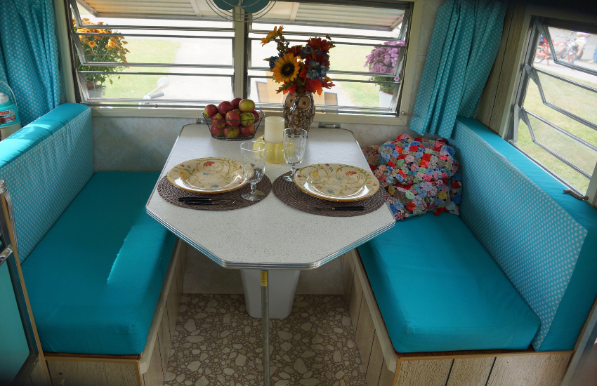 Camper Decor Ideas#5 Camper interior with blue dinette cushions.