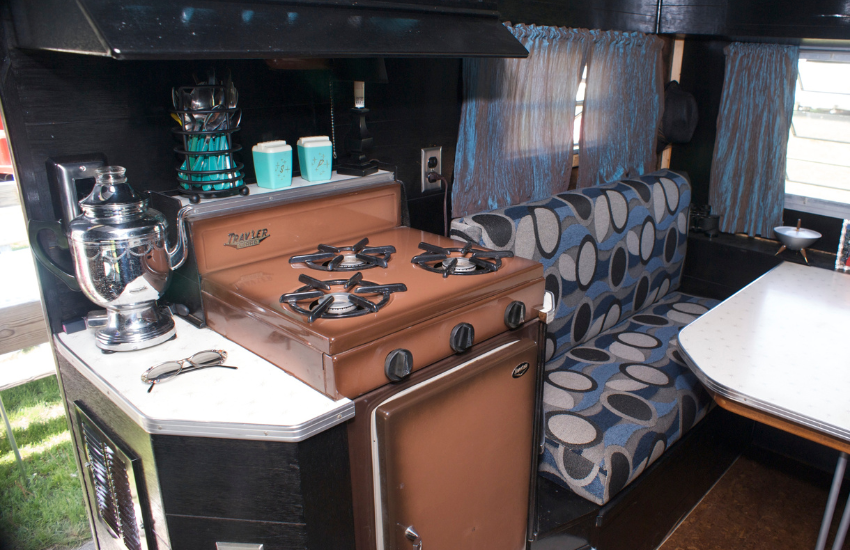 Camper Decor Ideas#9 Retro camper oven and patterned bench in a camper.