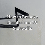 A graphic being removed from an RV sidewall.