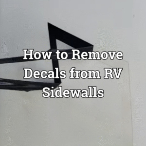 A graphic being removed from an RV sidewall.