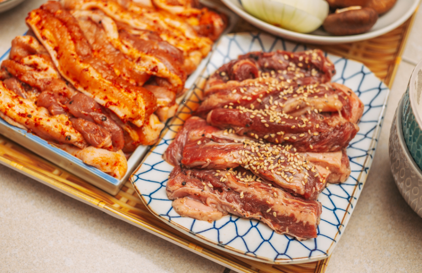 Marinated meats displayed on plates.