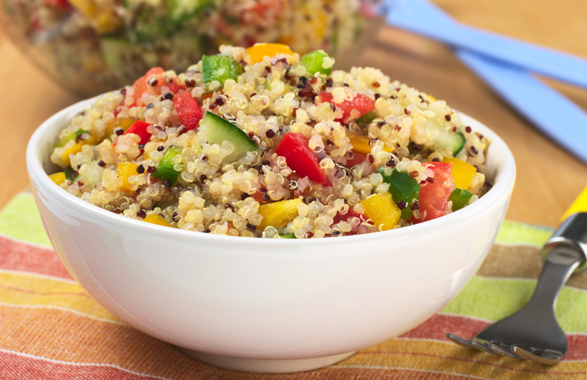 A bowl filled with quinoa salad.